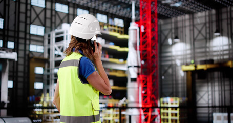 Poster - Female Engineer Conducting Phone Call Inside Aerospace Manufacturing