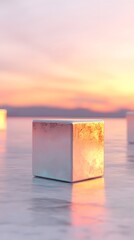 Poster - Reflective Metallic Cube at Sunset with Pink and Orange Sky