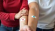 © DFN99 - Close-Up of Arms with Bandages After Blood Donation – Symbol of Care and Connection, world blood donor day