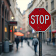 © YodiWFlow - Red Stop Sign on a Busy City Street.