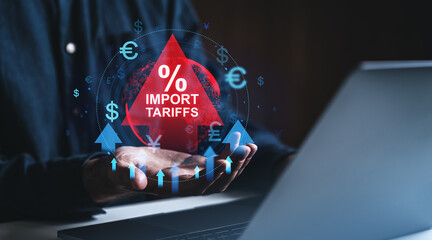 Poster - Rising import tariffs concept with red warning triangle and currency symbols, displayed above a businessperson's hand using a laptop in dark environment.