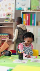 Poster - Happy children, drawing and playing in classroom for learning, education or childhood development. Group, students or elementary kids coloring with paper, chaos or disruption on table at school