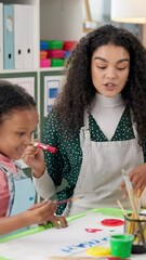 Aufkleber - Teacher, child and painting for art at school with help, creativity and happiness with color. Education, learning and kid with woman for development with paint and brush for kindergarten artwork