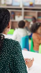 Aufkleber - Marking, education and back of teacher in classroom with preschool assignment, test or assessment. Teaching, pen and female educator with papers for childhood development, skills or growth at school.
