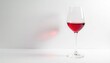 © Uravan - Single red wine glass, vibrant color on pure white backdrop , isolated, studio shot