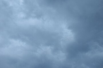 Wall Mural - dark rain cloud floating on sky at sunset in evening