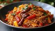 © jarmhan - Beef noodle stir-fry, peppers, closeup, dark background, food blog
