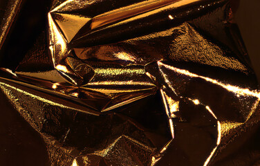 Poster - Golden and bronze foil texture with a glossy, metallic finish, creating a sleek, modern backdrop.