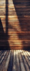 Poster - A warm toned rustic wooden floor with natural grain patterns and shadows cast by a bright light source creating a simple minimalist backdrop