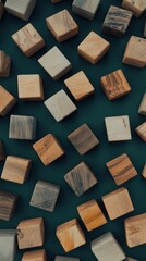 Poster - Arrangement of wooden cubes scattered across a deep green surface creating a textured pattern in natural tones and shapes.