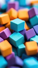 Poster - Close-up of scattered colorful square blocks. The blocks are various shades of orange blue and purple. The depth of field creates a blurred background.