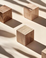 Poster - Close-up shot of textured wooden cubes with visible grain arranged on a beige surface cast shadows and a warm light creating an abstract composition