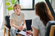 © Valerii Honcharuk - Teenage boy talking to female professional psychologist counselor therapist