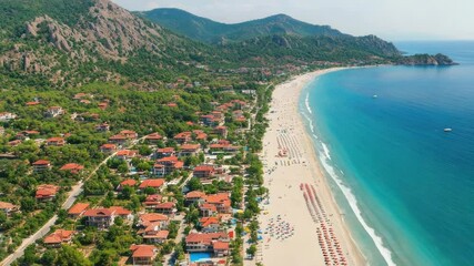 Poster - Aerial view of a beach and a resort, suitable for travel or tourism marketing