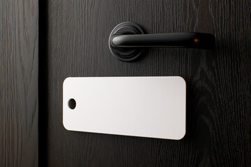 Poster - White blank sign on dark wood door with black handle, showcasing space for text or advertisement, ideal for mockups and signage design