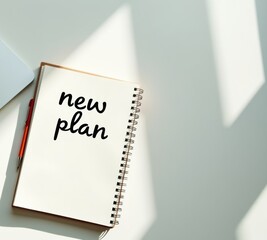Poster - New plan written in notebook on a minimalist desk  