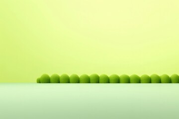 Poster - パステル調グリーン背景に並んだ球状の草むら ミニマルな構成 自然の美しさを表現した装飾的な壁紙素材