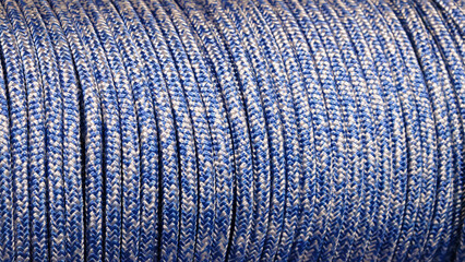 Poster - A blue and white rope is shown in the image. rope is long and has a striped pattern. blue and white colors create a sense of calmness and serenity.