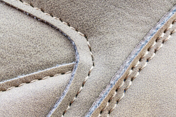Fototapete - close-up photograph showcasing contrasting stitching detail on a high-quality leather footwear inter