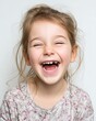 © rinrada - The girl laughed happily and lost one of her baby teeth.