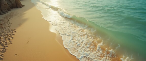 Poster - Ocean waves rolling onto a serene sandy beach during daytime