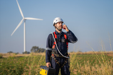 Aufkleber - Engineer man working with tablet at windmill farm Generating electricity clean energy. Wind turbine farm generator by alternative green energy.