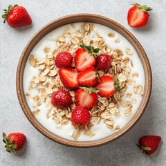 Aufkleber - Overhead studio shot of yogurt bowl with strawberries and oats for breakfast or snack on neutral surface