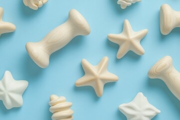Poster - Overhead flat lay of wooden starfish and massage tools on light blue background for wellness and relaxation
