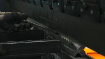 Poster - Metal bending machine operator skillfully crafts a precision part in workshop