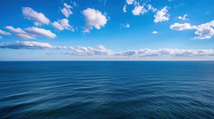 Aufkleber - A panoramic view of a vast, deep blue ocean stretching to the horizon under a bright, sunny sky with fluffy white cumulus clouds. : Generative AI
