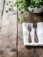 Aufkleber - Rustic wooden table setting with antique forks on a linen napkin, complemented by a blurred background of fresh herbs in a pot. : Generative AI