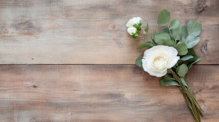 Poster - Elegant white ranunculus and eucalyptus bouquet arranged on rustic wooden surface, offering a minimalist floral design with copy space. : Generative AI
