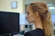 © Patel Studio - Young business woman looking at computer monitor during working day in office