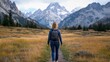 © Generative AI - Woman hiker with backpack enjoying scenic mountain trail, autumnal landscape, grand teton national park. : Generative AI