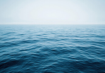 Aufkleber - A serene, expansive view of a calm ocean under a hazy sky, showcasing the tranquil, deep blue water with subtle waves. : Generative AI