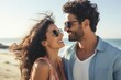 © Rawpixel.com - Hispanic couple hanging out at the beach together sunglasses laughing portrait.