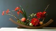 © yasna  - Elegant floral arrangement featuring vibrant red blooms in a sculptural container