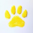 © Pateemoh - Vibrant yellow painted paw print on a clean white surface artistic animal symbol modern art element cheerful minimalist design pet adoption concept graphic resource