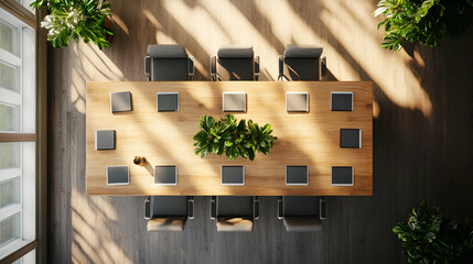 Poster - Long Wooden Conference Table with Laptops and Plants in Sunlit Office