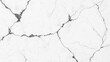 © somruthai - High-resolution image of white marble with thin, dark gray veining and cracks