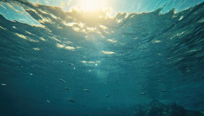 Aufkleber - Sunlight Filtering Through Deep Blue Ocean Water Creating a Mesmerizing Underwater Scene with Glistening Sun Rays and Rippling Surface Patterns