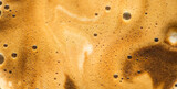 Coffee foam texture background, creamy coffee foam, rich, frothy surface, freshly brewed cup of hot latte. Espresso. Top view of cappuccino milk foam closeup. Creamy coffee macro shot