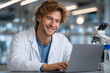 © Sarfan - Scientist working on laptop in lab (1)