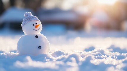Aufkleber - A small snowman, wearing a knitted hat, sits peacefully in a snowy landscape bathed in the warm glow of the winter sun. : Generative AI