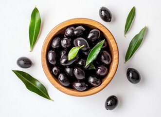 Aufkleber - A wooden bowl filled with glistening black olives, surrounded by fresh green olive leaves on a pristine white surface.  The olives appear ripe and juicy, ready to be enjoyed. : Generative AI