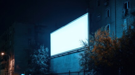 Aufkleber - Blank billboard glowing brightly at night, mounted on a building's wall, surrounded by trees and city lights. : Generative AI