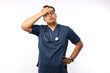 © ArvStd - Tired asian doctor man on white wall background in studio. Male doctor in white medical gown put hand on head. Healthcare personnel health medicine concept.