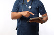 © ArvStd - Adult Asian male doctor with tablet in hospital. Health care and medicine concept.