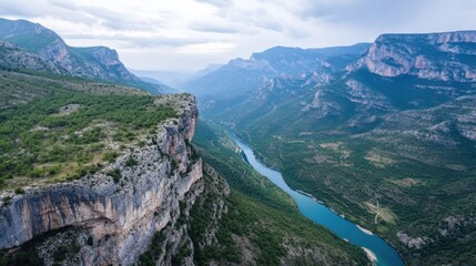 Poster - A stunning aerial view showcases a dramatic river winding through a deep canyon, surrounded by lush green vegetation and towering limestone cliffs under a partly cloudy sky. : Generative AI