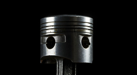 Poster - Close Up View of Worn Silver Piston Showing its Mechanical Structure and Design Against Dark Background